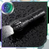 A black tactical flashlight is shown on a wet black surface, with water droplets on the flashlight and the surface. A circular graphic with a shield and water drops is in the upper left corner. Produktbild-Vorschau