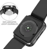 A close-up view of the back of a black Apple Watch case, showing the charging port and heart rate sensor. A circular inset shows the watch being placed on a charger. Produktbild-Vorschau