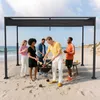 A group of friends are having a barbecue on the beach under a black pergola. Náhľad obrázku produktu