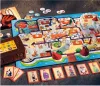 A board game laid out on a dark surface, with cards and game pieces scattered around. Produktbild-Vorschau