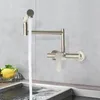 A kitchen faucet with water running into a sink. Podgląd zdjęcia produktu