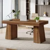 A modern home office desk with a laptop and a plant. Anteprima dell’immagine prodotto