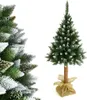 A close-up of a flocked artificial Christmas tree on the left and a full view of a smaller flocked artificial Christmas tree on a stand on the right, both on a white background. Náhľad obrázku produktu