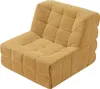 A single yellow floor chair with a tufted design, shown from a diagonal angle against a white background. Náhled obrázku produktu