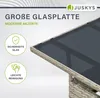 A close-up view of a table with a glass top, showcasing its design and features. Produktbild-Vorschau