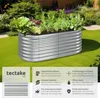 A raised garden bed filled with plants, set in a garden with green grass and bushes. Produktbild-Vorschau