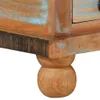A close-up view of the bottom corner of a wooden table, showing its leg and base. Produktbild-Vorschau