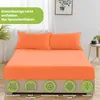 A bed with orange fitted sheets and pillows, with marketing icons at the bottom. Produktbild-Vorschau