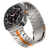 A smartwatch with a metal band and an orange accent. Náhled obrázku produktu