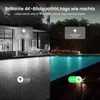 Split image showing a house and pool at night, with one side in black and white (IR night vision) and the other in color (spotlight). Produktbild-Vorschau