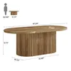 A diagram showing the dimensions of an oval coffee table with a human silhouette for scale. Voir les images du produit