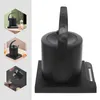 A collage of images showing a black electric kettle on its base, with close-ups and usage examples. Podgląd zdjęcia produktu