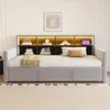 A light gray upholstered daybed with a built-in headboard featuring shelves and LED lighting, set in a bedroom. Voir les images du produit