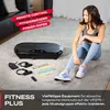 A woman is sitting on the floor next to a vibration plate and fitness accessories. Produktbild-Vorschau