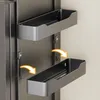Two gray shelves are mounted on a dark gray surface, with yellow arrows indicating movement. Anteprima dell’immagine prodotto