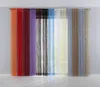 A set of string curtains in various colors hanging in front of a window. Produktbild-Vorschau