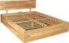 A wooden bed frame with a slatted base and a headboard, shown from a diagonal angle against a white background. Produktbild-Vorschau