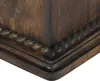 A close-up view of the corner of a dark wooden urn with decorative rope-like carving. Podgląd zdjęcia produktu