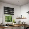 A modern kitchen with a window, sink, and blinds. Voir les images du produit