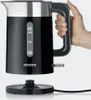 A hand holding a black electric kettle over its base. Produktbild-Vorschau