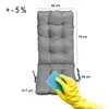 A gray cushion is shown with dimensions and a hand wearing a yellow glove cleaning it with a blue sponge. Produktbild-Vorschau