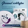 A pillow is shown next to a washing machine, with a magnified view of a pillowcase showing 'germs' being removed by washing. Produktbild-Vorschau