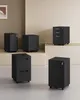 Several black filing cabinets are arranged on a staged background. Náhled obrázku produktu