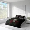 A bedroom scene with a bed featuring skull and rose bedding, a large window, and a nightstand. Produktbild-Vorschau