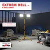 Construction site at dusk with a bright LED work light illuminating the area. Produktbild-Vorschau