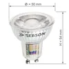 A close-up studio shot of an LED light bulb with dimensions indicated. Produktbild-Vorschau