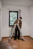 A man is standing on a ladder in an empty room. Anteprima dell’immagine prodotto