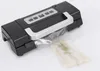A black and silver Caso vacuum sealer with a silver handle is shown on a white background. A plastic bag containing food is being sealed. Podgląd zdjęcia produktu