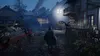 A dark, atmospheric scene in what appears to be a village at dusk or night. A person in dark clothing walks away from the camera down a muddy path. There are buildings on either side, some with lights on. A drone is visible hovering near a building on the  Produktbild-Vorschau