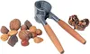 A nutcracker with various nuts scattered around it. Podgląd zdjęcia produktu