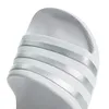 A close-up view of the top of a white Adidas slipper with silver stripes. Produktbild-Vorschau