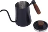 A black pour-over coffee kettle with a wooden handle and a separate lid with a wooden knob, shown on a white background. Podgląd zdjęcia produktu