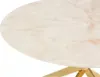 Close-up of a round table with a marble-like top and gold metal legs. Anteprima dell’immagine prodotto