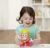 A young girl is playing with a Mr. Potato Head toy. Anteprima dell’immagine prodotto
