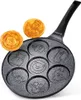 A frying pan with seven animal-shaped molds, with two animal-shaped pancakes on top. Anteprima dell’immagine prodotto