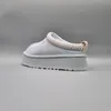 A single light blue UGG Tazz slipper is shown from the side against a plain gray background. Produktbild-Vorschau