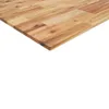A close-up, angled view of a wooden countertop or tabletop made of several planks of acacia wood. Náhled obrázku produktu