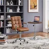 A home office setup with a bookshelf, chair, and small table with a laptop. Produktbild-Vorschau