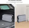 A folded pet bed is shown in two different settings: inside the trunk of a car and leaning against a wall in a room. Voir les images du produit