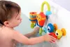 A toddler playing with a bath toy in a bathtub. Podgląd zdjęcia produktu