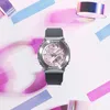 A G-Shock watch is displayed against a background of colorful abstract shapes. Produktbild-Vorschau