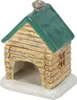 A ceramic oil burner shaped like a log cabin. Voir les images du produit