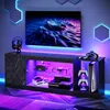 A modern entertainment center with a TV and gaming equipment, illuminated by RGB LED lights. Anteprima dell’immagine prodotto