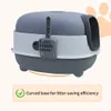 A gray and white enclosed cat litter box with a scoop attached. Anteprima dell’immagine prodotto
