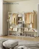 A well-organized clothing rack with shelves in a bedroom setting. Produktbild-Vorschau