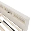 A close-up view of the headboard of a bed, showing built-in storage compartments and a wooden slat base. Podgląd zdjęcia produktu